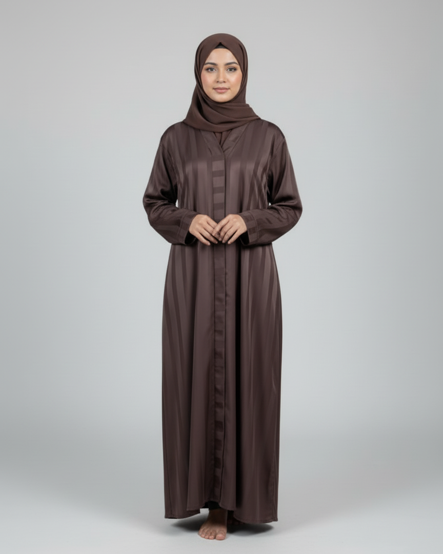Woman wearing a brown abaya and hijab on a white background
