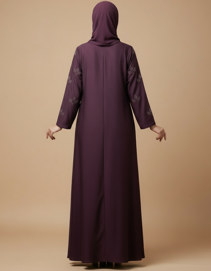 Purple abaya with floral embroidery on a beige background
