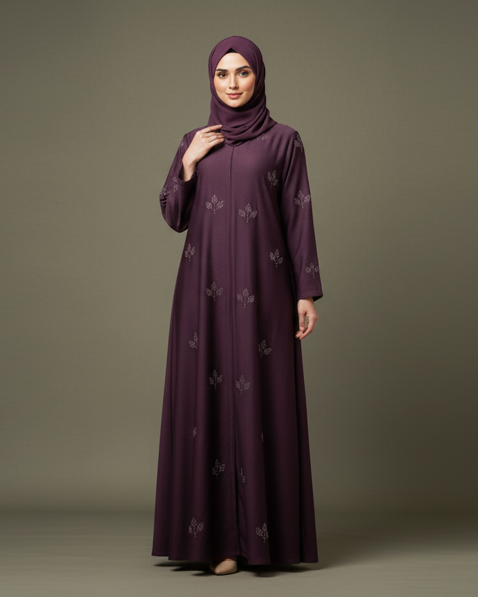 Woman wearing a long dark purple dress with a matching hijab on a gray background