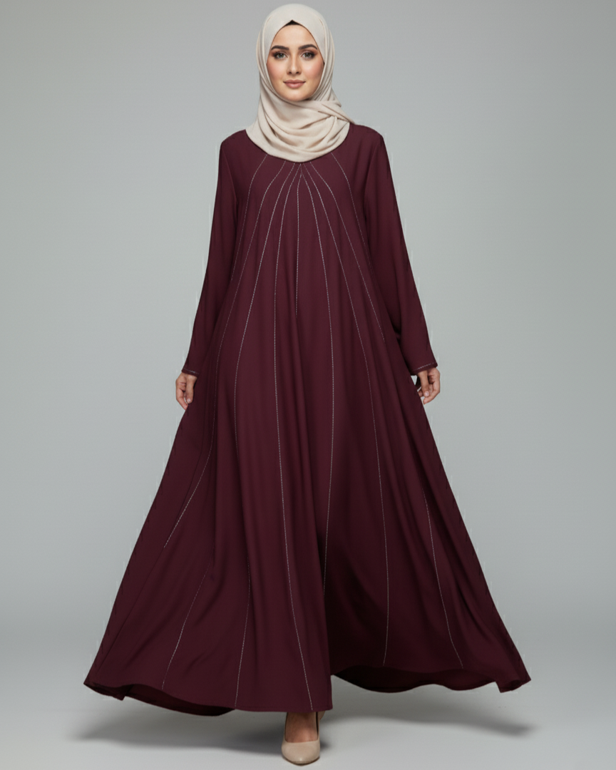 Maroon dress with beige hijab on a gray background