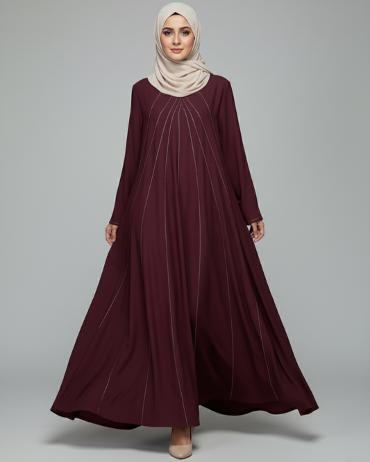 Maroon dress with beige hijab on a gray background